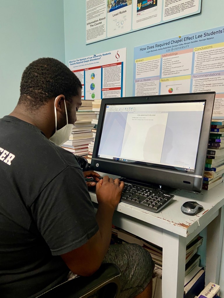 Photo of JayJay working at Luis Camillo's office at Talladega College.  