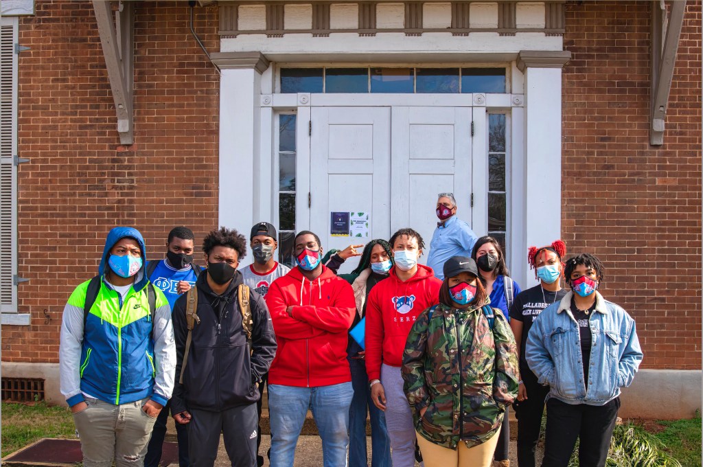 Photo of students and Luis Camillo outside class at Talladega College.