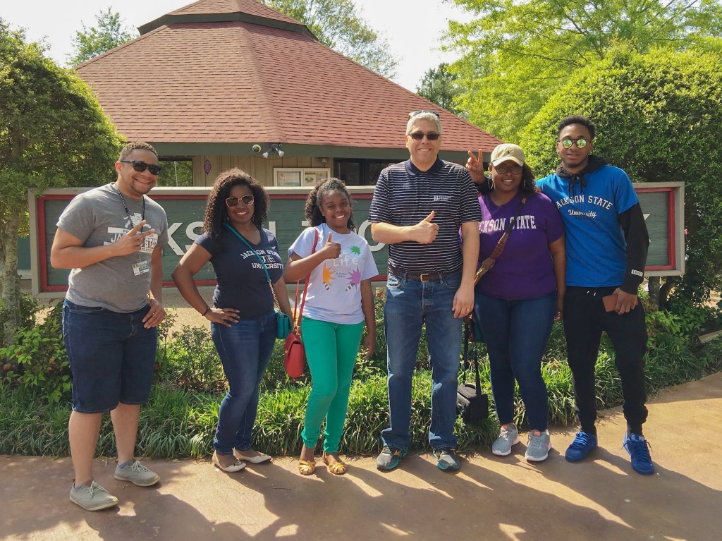 Photo of Luis Camillo and  JSU Students. 